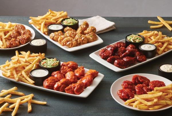 Platters stacked with different fried foods.